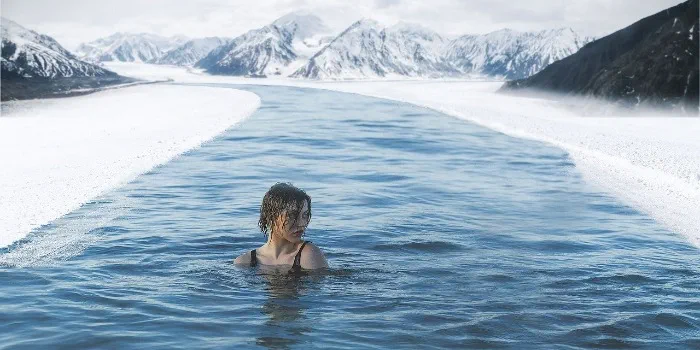 Person swimming in cold water